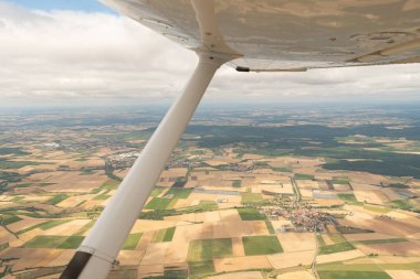 Bavaria, Germany, July 10, 2022 Flight over some arable fields with a small plane