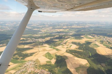 Homburg, Germany, July 10, 2022 Flight across some farming fields in a small plane