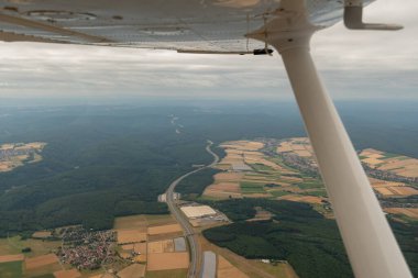 Marktheidenfeld, Bavaria, Germany, July 10, 2022 Flight across the highway A3 with a small airplane