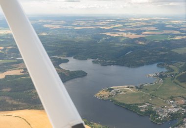 Saalburg-Ebersdorf, Thuringia, Germany, July 10, 2022 Flight over the Bleiloch dam with a small airplane