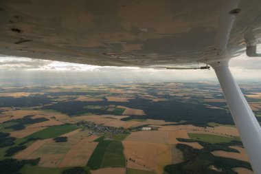Saxony, Germany, July 10, 2022 Rural fields seen from a small airplane