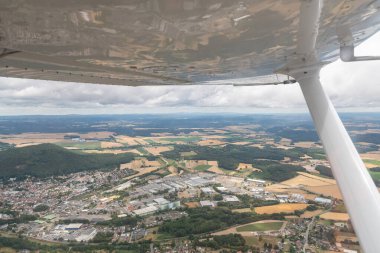 Neustadt bei Coburg, Bavaria, Germany, July 11, 2022 Flight along the city center with a small plane