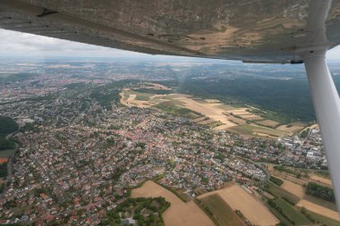 Hoechberg, Bavaria, Germany, July 11, 2022 View over the city center from a small airplane