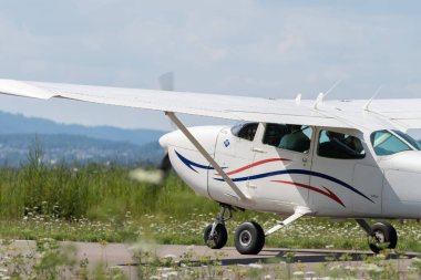 Wangen-Lachen, Switzerland, July 31, 2022 Reims Cessna 172P Skyhawk II propeller plane is landing on a small airfield