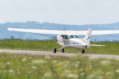 Wangen-Lachen, Switzerland, July 31, 2022 Reims Cessna 172P Skyhawk II propeller plane is landing on a small airfield