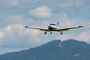 Wangen-Lachen, Switzerland, July 31, 2022 Piper PA28-181 Archer III propeller plane is landing on a small airfield