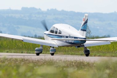Wangen-Lachen, Switzerland, July 31, 2022 Piper PA28-181 Archer II is landing on a small airfield