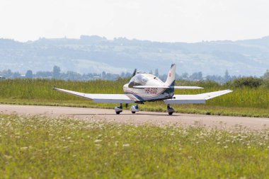 Wangen-Lachen, Switzerland, July 31, 2022 Robin DR400-180R propeller plane is landing on a small airfield
