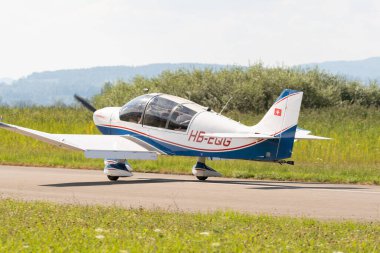 Wangen-Lachen, Switzerland, July 31, 2022 Robin DR400-180R propeller plane is landing on a small airfield