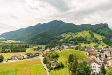 Balzers, Liechtenstein, June 5, 2022 View over the alpine area and the small town on a cloudy day