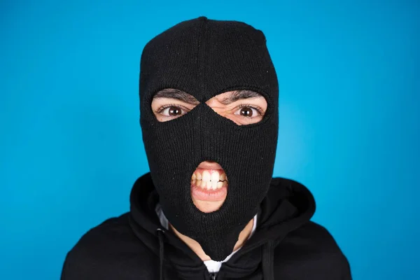 Portrait Angry Criminal Delinquent Wearing Black Ski Mask Isolated Blue — Stock Photo, Image