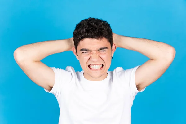 Angry Despaired Hispanic Teenager Boy Hands Head Isolated Blue Background — 스톡 사진