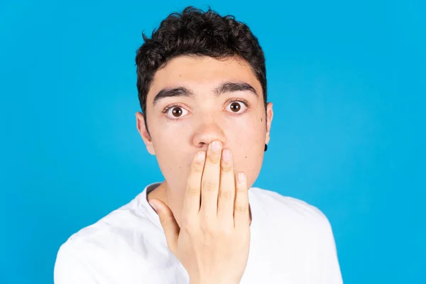 Portrait Surprised Hispanic Teenager Boy Hand Mouth Looking Camera Isolated — Foto de Stock