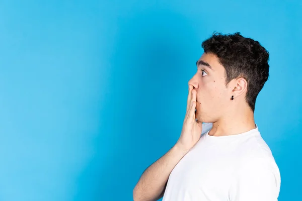 Side View Surprised Hispanic Teenager Boy Isolated Blue Background — 스톡 사진