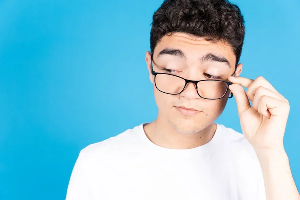 Hispanic Teenager Nerd Boy Looking Glasses Copy Space Isolated Blue — Stockfoto