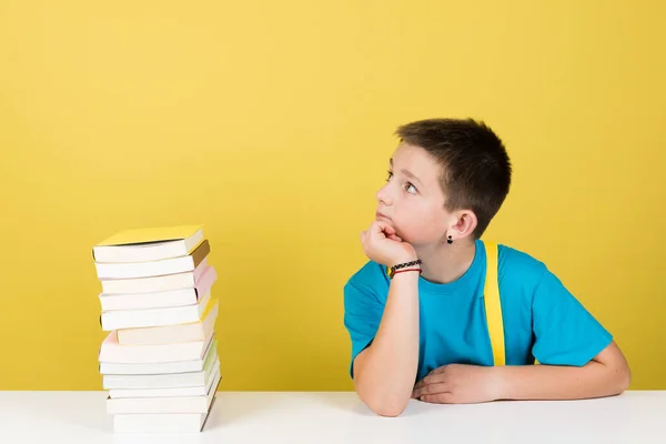 Student Boy Thinking Pile Books Isolated Yellow Background — Stockfoto