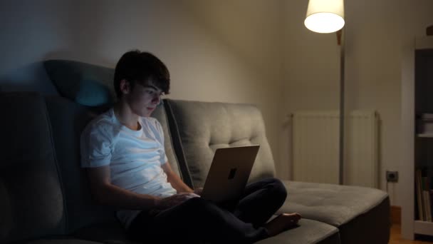 Teenager Boy Working Laptop Night Living Room Sitting Couch Tired — Vídeo de stock