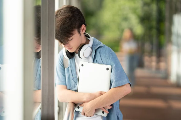 Sad Teenager Boy Holding Laptop Wall Corridor College Depression Concept — Stockfoto