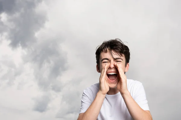 Angry Teenager Boy Shouting Dramatic Sky Copy Space — Zdjęcie stockowe