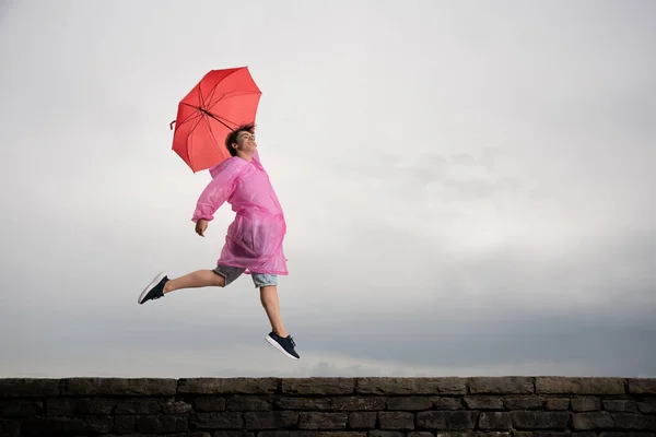 Happy Teenager Boy Jumping Dancing Rain Bad Weather Positivity Concept — 스톡 사진