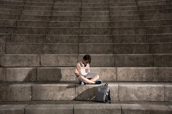 Teenager Boy Working Laptop Sitting Staircase Dramatic Lighting — ストック写真