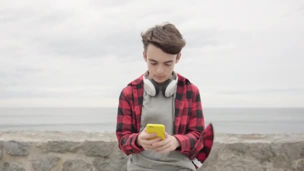 Sad Teenager Boy Receiving Bad News Phone Outdoors Coast Cloudy — Stock Video