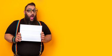 Big funny bearded man wearing glasses and holding a blank lightbox
