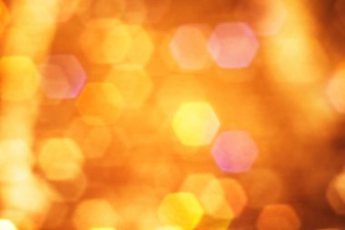 Orange background with hexagon bokeh