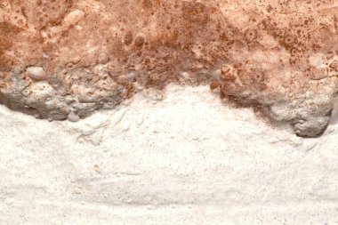 Texture of white and brown stone surface close-up full frame. Stone canyon top view