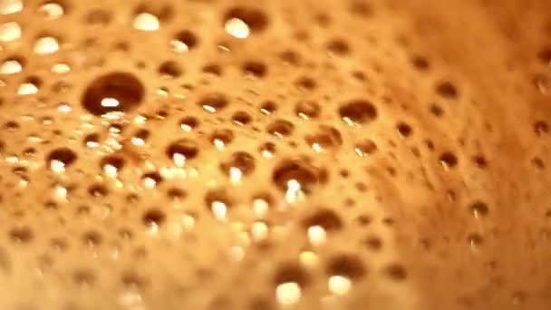 Bubbles Froth Surface Hot Cocoa Being Stirred Close — Video