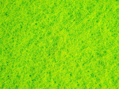 Yeşil çamaşır süngerinin dokusu arkaplan ve metin için kapat