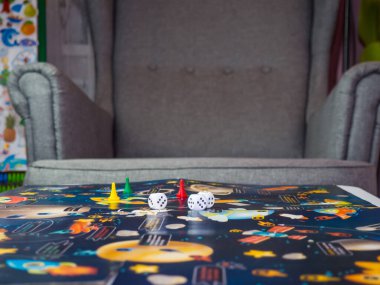 board games concept. Dice, chips and cards on the background of the playing field copy space