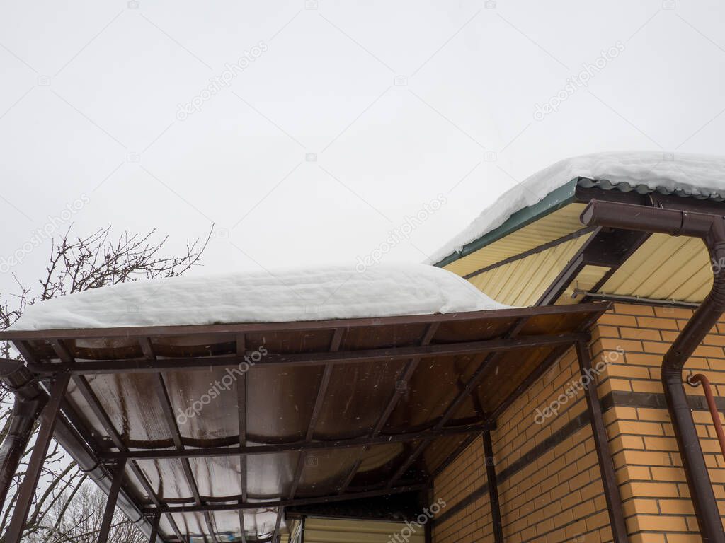 polycarbonate canopy roof under a pile of snow