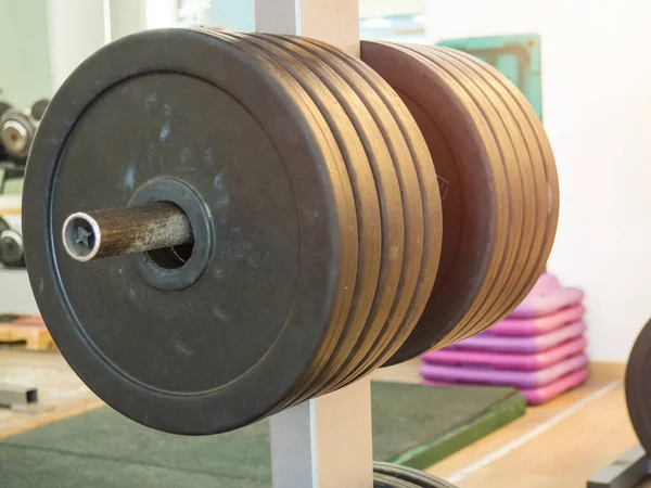 Close up image of fitness equipment in the gym,barbell,barbell pancakes