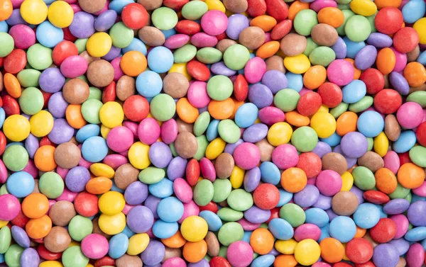 Texture of multi-colored round candies bright and colorful background, — Foto de Stock