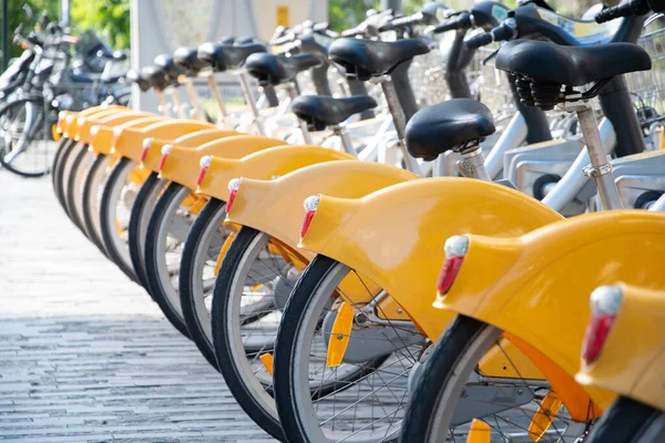 public yellow bicycles parked in the sharing on the street BRUSSELS, BELGIUM High quality photo