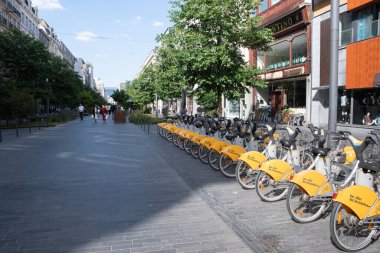 BRUSSELS,BELGIUM - June 02, 2022: public Villo bicycles parked in the sharing, High quality photo