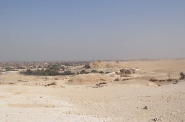 Sandy landscape in the desert in Cairo in front of the famous Egyptian pyramids neutral background. High quality photo