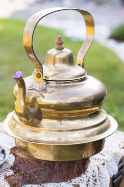 copper vintage teapot and banana cream cake at picnic outdoor,vintage background,High quality photo