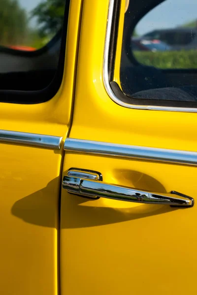 Door Handle Yellow Restored Classic Car Photo Taken Natural Light — стоковое фото