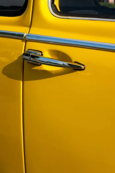 Door Handle Yellow Restored Classic Car Photo Taken Natural Light — стоковое фото