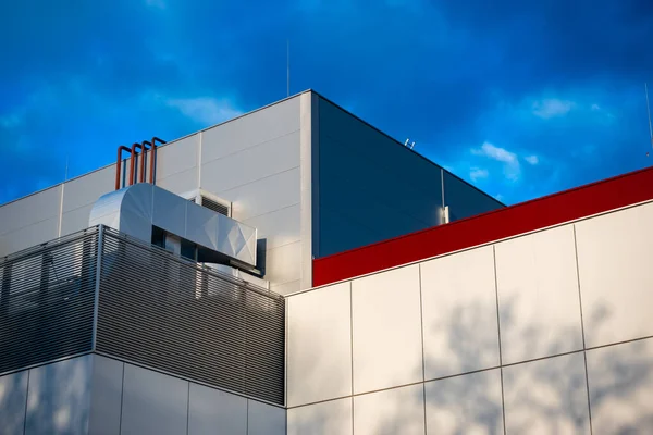 Ventilation and air conditioning systems on the roof of a modern building. HVAC system photographed against a blue sky on a sunny afternoon