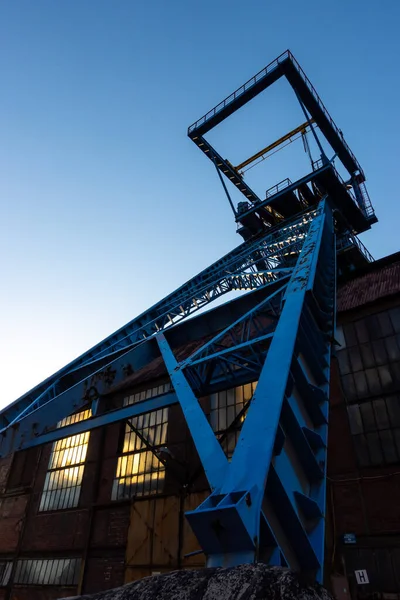 The shaft tower of a closed black coal mine. Decarbonization processes in the modern world during the energy crisis