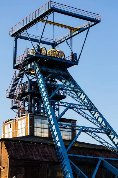 The shaft tower of a closed black coal mine. Decarbonization processes in the modern world during the energy crisis