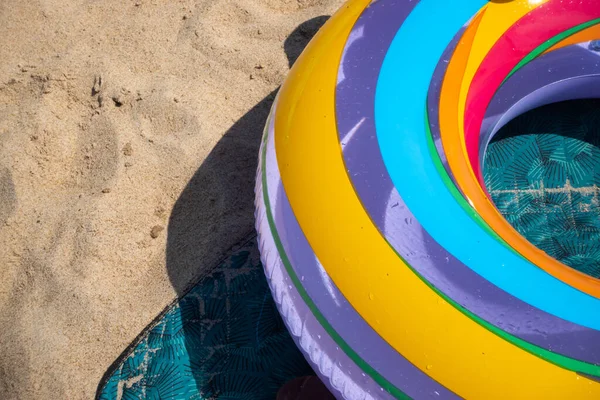 Colorful Inflatable Beach Wheel Lying Sand Photo Taken Noon Sunny — Stock fotografie