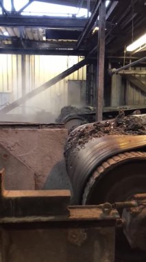 Two conveyor belts with incinerated waste, VERTICAL footage