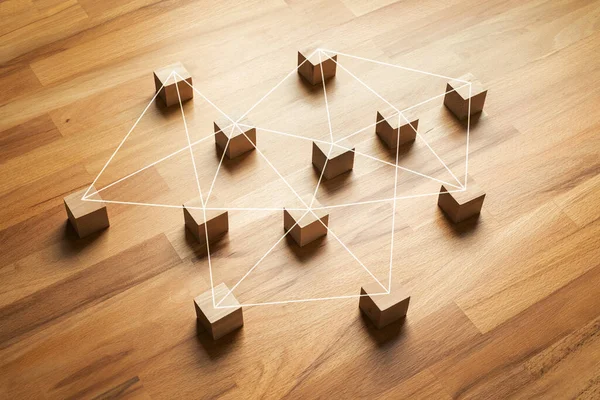 Connection or networking concepts with wood block.teamwork management for organization