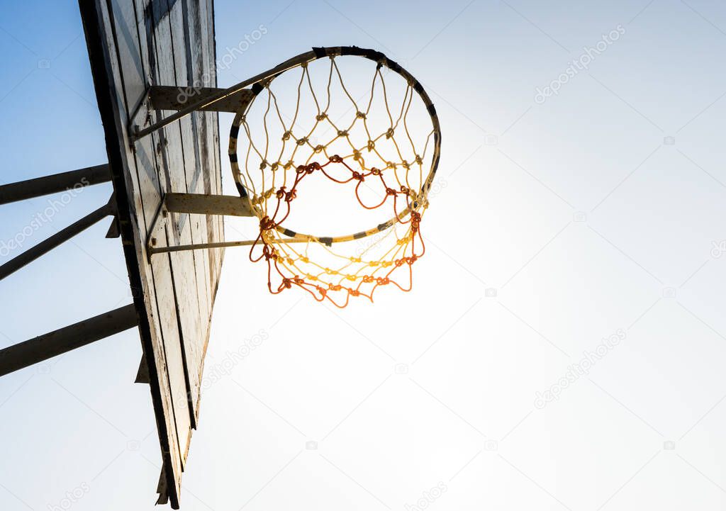 Basketball hoop in sunlight and sky / for goal concept