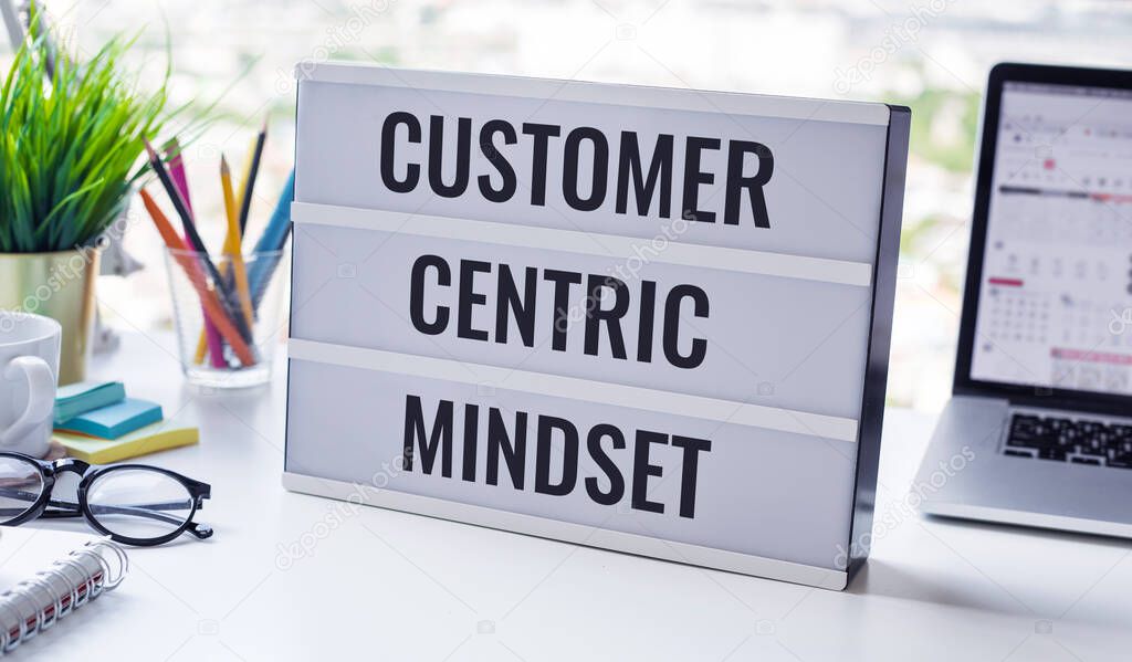 Customer centric mindset text with work table.business service.no people