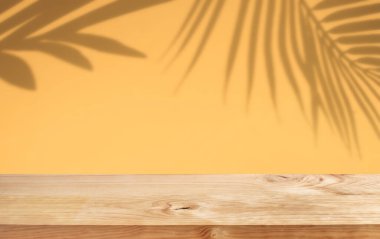 Selective focus.Nature product display with wood table counter on palm leaf in vibrant color background.For key visual layout